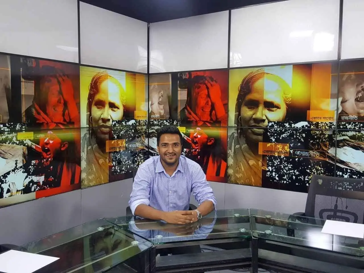 Cyrus seated in a television studio