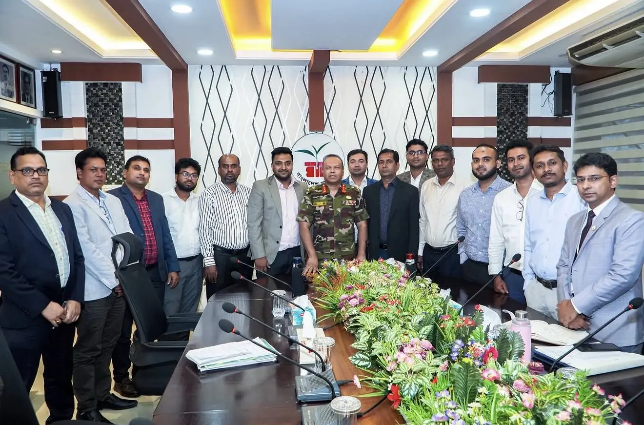 Cyrus with business and public-sector leaders around a conference table