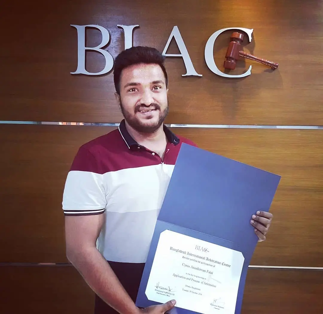 Cyrus holding a professional training certificate